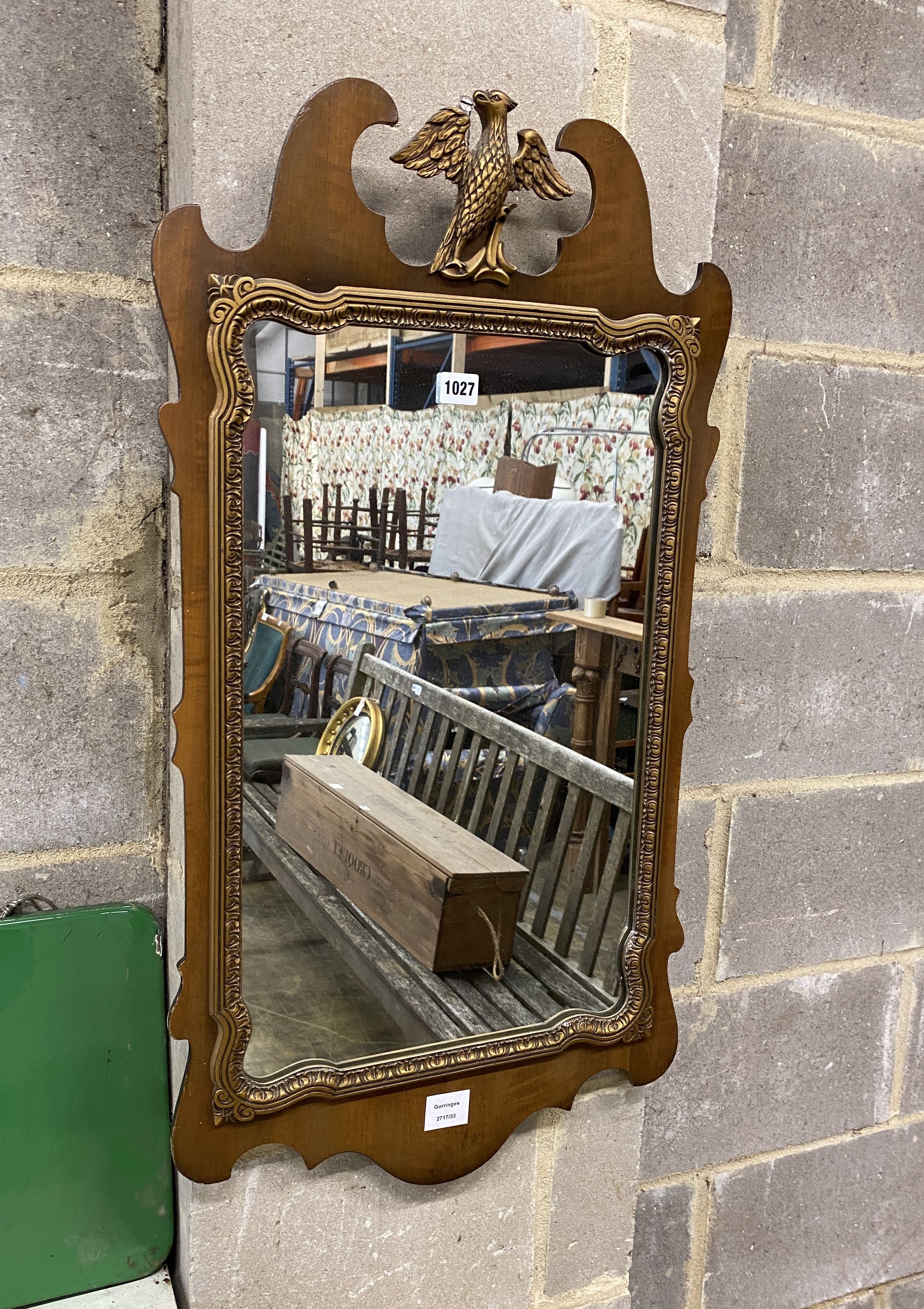 A George III style walnut fret cut wall mirror, width 47cm, height 86cm